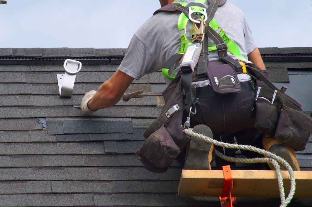 what to do when wind damages your roof in Longmont